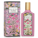 Elegant pink glass bottle of Gucci Flora by Gucci Gorgeous Gardenia Eau De Parfum Spray, capturing floral allure and femininity.