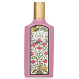 Elegant pink glass bottle of Gucci Flora Gorgeous Gardenia Eau De Parfum, featuring floral notes for a feminine touch.