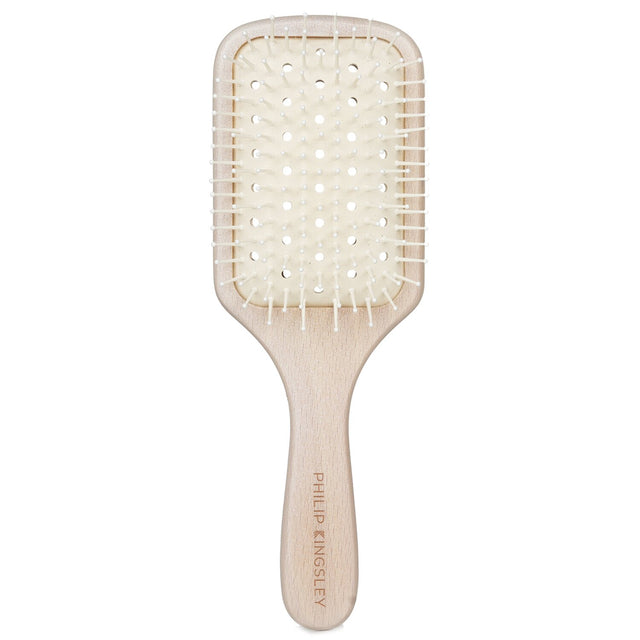 Philip Kingsley Vented Paddle Brush designed for thicker, longer hair; features antistatic properties and a cushioned, gentle grip.