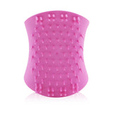 Scalp exfoliator brush in Pretty Pink, designed for detoxifying and massaging scalp health with dual teeth and winged grip.