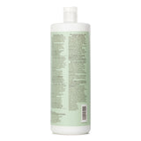 Paul Mitchell Clean Beauty Anti-Frizz Conditioner 1000ml, enriched with almond oil and hyaluronic acid for smooth, manageable hair.