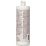 Paul Mitchell Clean Beauty Repair Shampoo 1000ml, eco-friendly, sulfate-free, restores strength to damaged hair with floral musk scent.