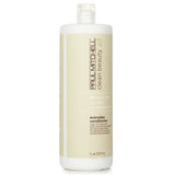 Paul Mitchell Clean Beauty Everyday Conditioner 1000ml, a vegan, sulfate-free formula with argan oil and aloe for soft, manageable hair.