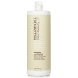 Ultra-rich, vegan conditioner with argan oil and aloe vera, promoting healthy, manageable hair in a 1000ml bottle.