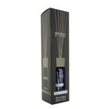 Millefiori Crystal Petals fragrance diffuser in elegant glass bottle, enhances home ambiance with natural scent and wooden sticks.