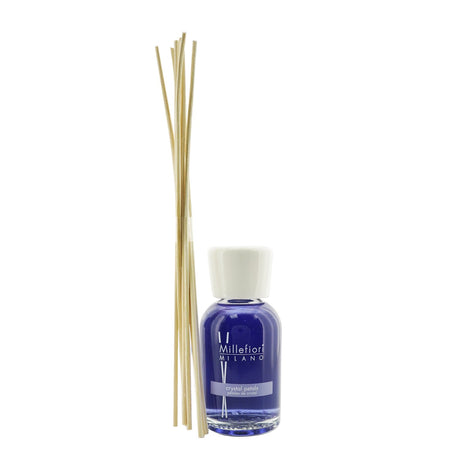 Millefiori Natural Fragrance Diffuser in Crystal Petals scent, featuring elegant glass bottle and dark wooden sticks for lasting aroma.