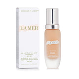 La Mer Soft Fluid Long Wear Foundation SPF 20 in #140 Alabaster, offering lightweight, long-lasting coverage and UV protection.