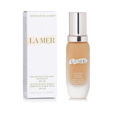 La Mer Soft Fluid Long Wear Foundation SPF 20 in Warm Cameo, offering lightweight, nourishing coverage with true color retention.