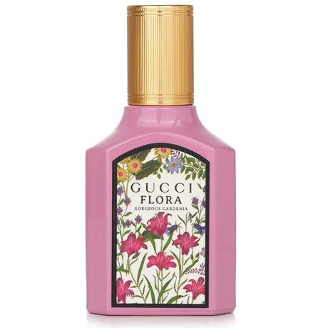 Elegant pink glass bottle of Gucci Flora Gorgeous Gardenia Eau De Parfum, showcasing notes of floral, fruity, and warm scents.