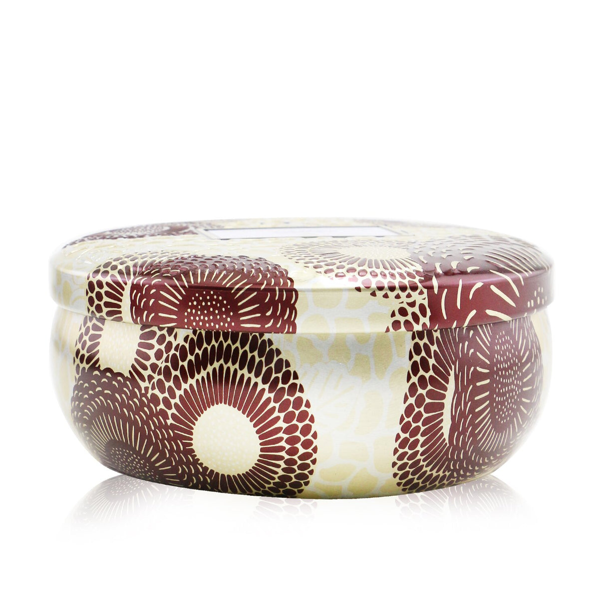 Voluspa 3 Wick Decorative Tin Candle in Gilt Pomander & Hinoki, featuring a sophisticated fragrance and ornate metallic design.