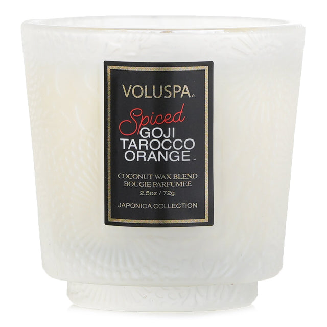 Voluspa Petite Pedestal Candle in Spiced Goji Tarocco Orange, featuring coconut wax and a luxurious glass container.