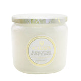 Petite Voluspa candle in Eucalyptus & White Sage, housed in a decorative glass jar with 35-hour burn time.