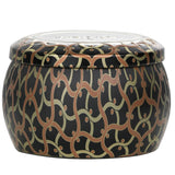 Decorative Voluspa mini tin candle in Burning Woods, featuring a vibrant Japanese design and eco-friendly coconut wax blend.