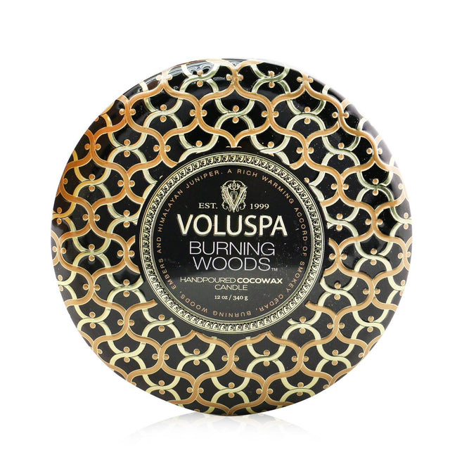 Voluspa 3 Wick Decorative Tin Candle in Burning Woods, featuring a luxurious coconut wax blend and ornate metallic design.