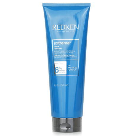 Redken Extreme Mask 250ml: Deep conditioning treatment for damaged hair, featuring amino acids and lactic acid for strength and smoothness.