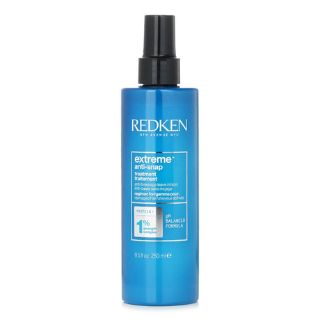 Redken Extreme Anti-Snap Leave-In Treatment for damaged hair, enriched with amino acids, provides strength, smoothness, and heat protection.