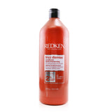 Redken Frizz Dismiss Conditioner 1000ml, for frizzy hair, features Babassu oil for deep moisture, detangling, and shine enhancement.