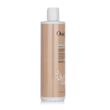 Ouidad Curl Shaper shampoo in 355ml bottle, a moisture-restoring formula for cleansing and hydrating loose curls.