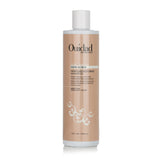 Ouidad Curl Shaper Moisture Restoring Shampoo in a 355ml bottle, ideal for cleansing and hydrating loose curls without stripping.