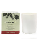Cowshed Cosy Candle: 220g aromatic blend of rose and patchouli, eco-friendly soy wax, burns for 60 hours, enhancing relaxation.