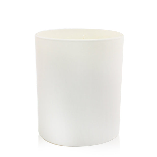 Cowshed Cosy Candle: 220g soy wax candle with rose absolute and patchouli, offering a spicy floral aroma for 60 hours.