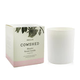 Cowshed Indulge Candle, 220g, floral aroma of lavender, ylang ylang, and Moroccan rose; eco-friendly, burns for 60 hours.