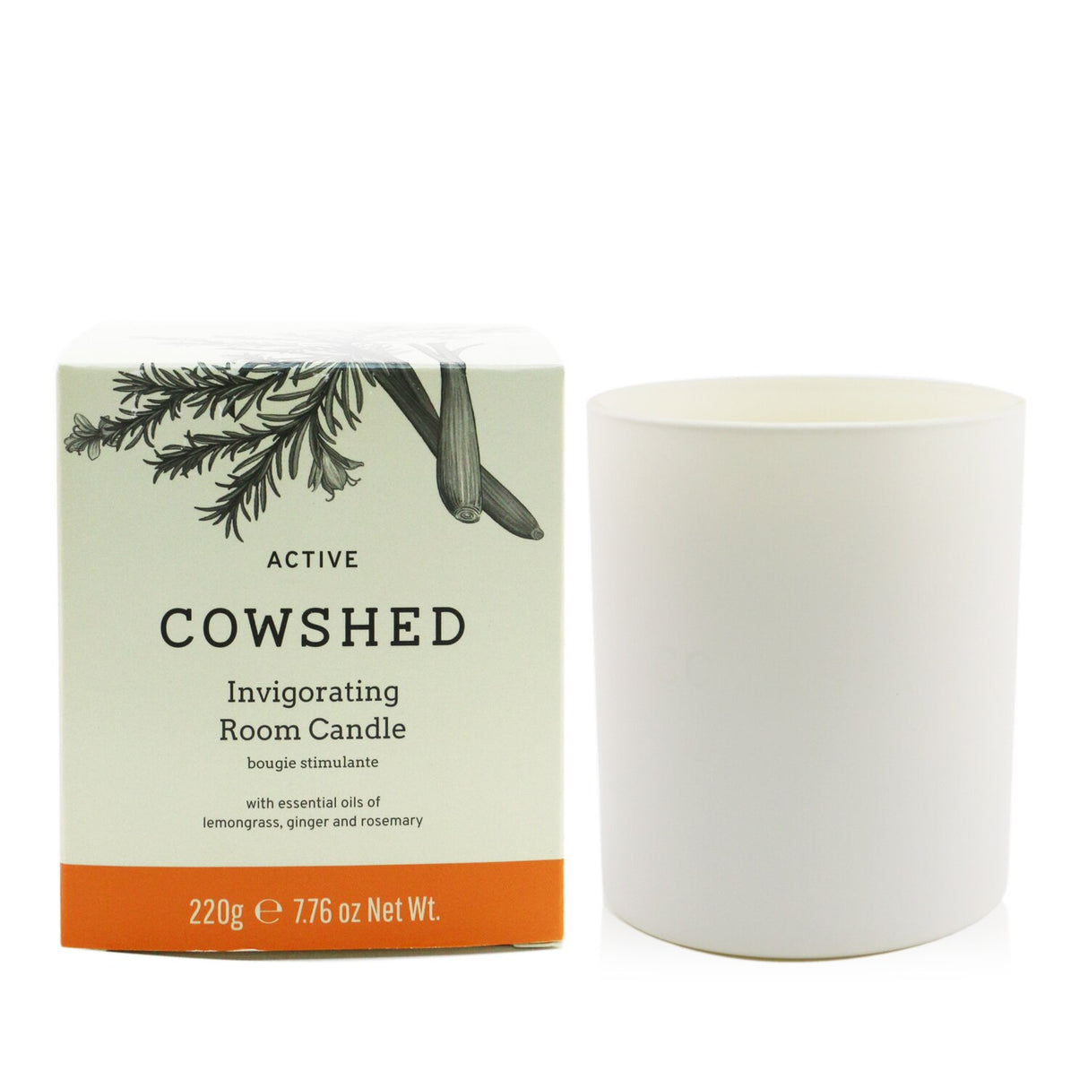 Cowshed Active Candle in a chic glass jar, infused with lemongrass, ginger, and rosemary for a stimulating, clean burn.