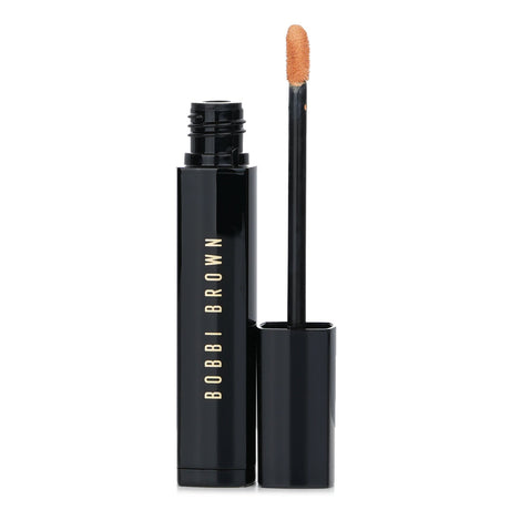 Bobbi Brown Intensive Serum Concealer in #Honey, a silky liquid formula that brightens and evens skin tone, ideal for dark circles.