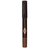 Luxurious Charlotte Tilbury eye shadow pencil in #Amber Haze, enhancing eye color with vibrant shimmer, lasting 10 hours.