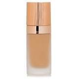 Charlotte Tilbury Airbrush Flawless Foundation #7.5 Warm, 30ml, offers full coverage, hydration, and anti-aging benefits for a flawless look.