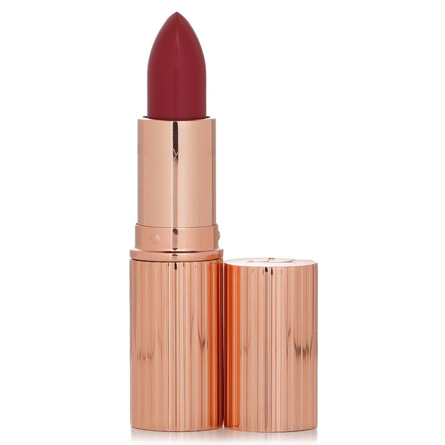 Charlotte Tilbury K.I.S.S.I.N.G Lipstick #So Red offers vibrant color and hydration, featuring UV protection for soft, supple lips.