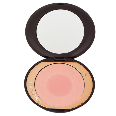 Charlotte Tilbury Cheek To Chic Blusher in #Ecstasy, a creamy powder blush for a radiant, buildable glow.