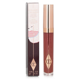 High-shine lip gloss in milky pink, enriched with collagen and coconut oil for hydrated, fuller lips.