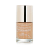 Lightweight hydrating foundation in shade #112 Sandalwood, offering natural matifying finish and SPF 15 for radiant skin.