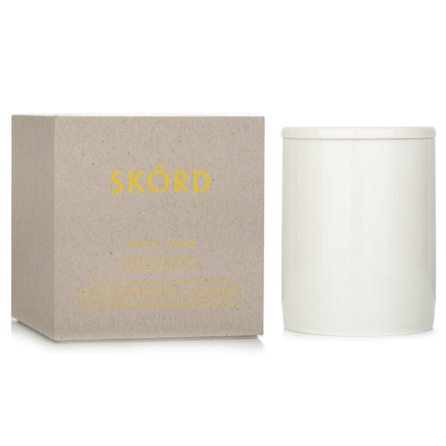 Vegan Bjork & Berries scented candle in Skord, featuring autumn scents, elegant container, and a 55-hour burn time.
