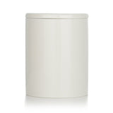 Hand-poured vegan scented candle with green fir, cedarwood, and eucalyptus, burning 55 hours, in a decorative reusable container.