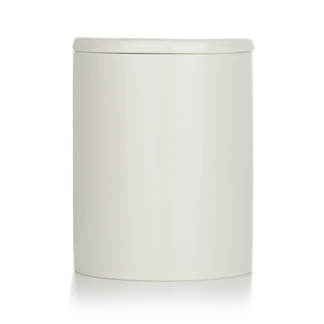 Eco-friendly Bjork & Berries Midvinternatt candle in decorative container, scented with green fir, cedarwood, and eucalyptus.