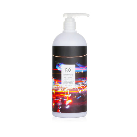 R+Co Sunset BLVD Daily Blonde Conditioner in 1000ml, brightens blonde hair, detangles, seals moisture, and with a delightful aroma.