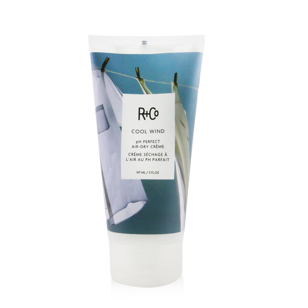 R+Co Cool Wind Air-Dry Creme in 147ml, a vegan styling cream to tame frizz and enhance natural hair shine without heat.