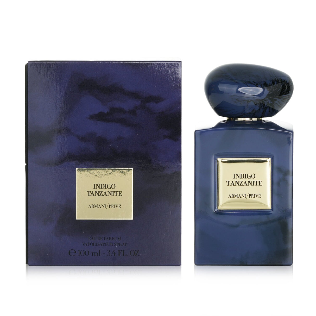 Giorgio Armani Prive Indigo Tanzanite Eau De Parfum in a stunning purple-blue bottle, offering a woody amber scent for all.