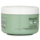 Kerastase Cleansing Clay for oily roots, infused with Kaolin, deeply purifies scalp while nourishing dry ends for balanced hair.