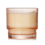 Elegant Paddywax Al Fresco Candle in Pepper + Plum, featuring a reusable tinted glass vessel and eco-friendly soy wax.