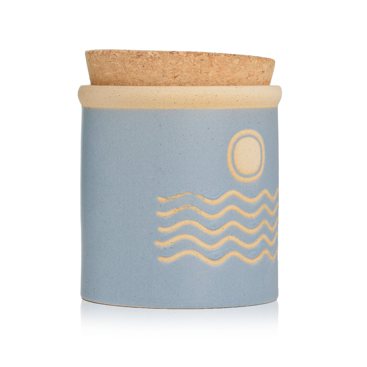 Luxurious Paddywax Dune Candle in Saltwater Suede, housed in an organic ceramic vessel with a cork lid, burns for 56 hours.