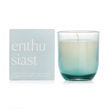A beautiful 141g soy wax candle in an ombre glass vessel, inspired by the Enthusiast personality, for a unique home fragrance experience.