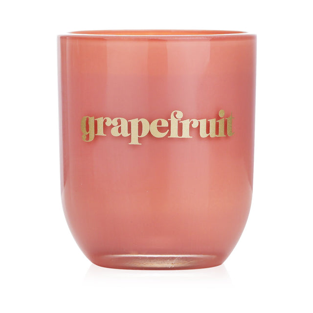 Petite soy wax candle in glossy glass, featuring vibrant grapefruit scent, burns cleanly for 35 hours, perfect for gifts.