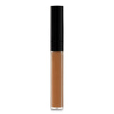 Chanel Longwear Concealer #BD121 in a sleek tube; creamy, hydrating formula blurs imperfections and brightens the complexion.