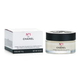 Chanel N°1 Red Camellia Revitalizing Eye Cream in a 15g jar, designed to illuminate and rejuvenate the eye area.