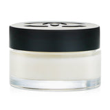 Chanel N°1 Red Camellia Eye Cream in a sleek jar, revitalizes and smooths the eye area with natural ingredients.