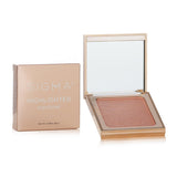 A sleek mirrored compact with a buttery soft, vegan highlighter in Sunstone, perfect for achieving a radiant glow.