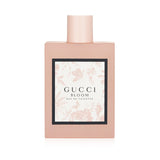 Frosted pale pink bottle of Gucci Bloom Eau De Toilette 100ml, featuring floral notes and a stunning Herbarium print.